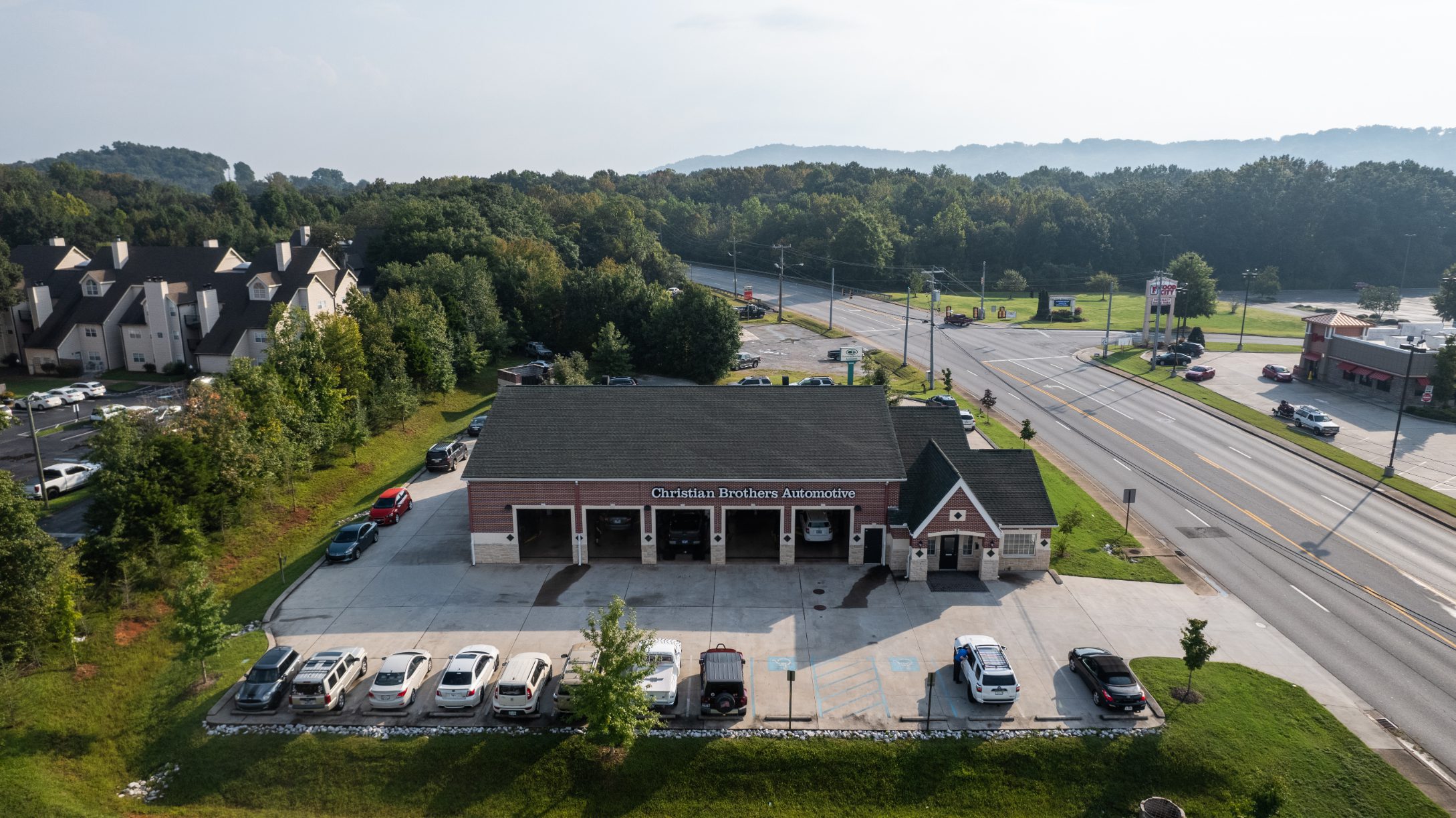 Aerial view of the shop, its parking bays and landscaped edges