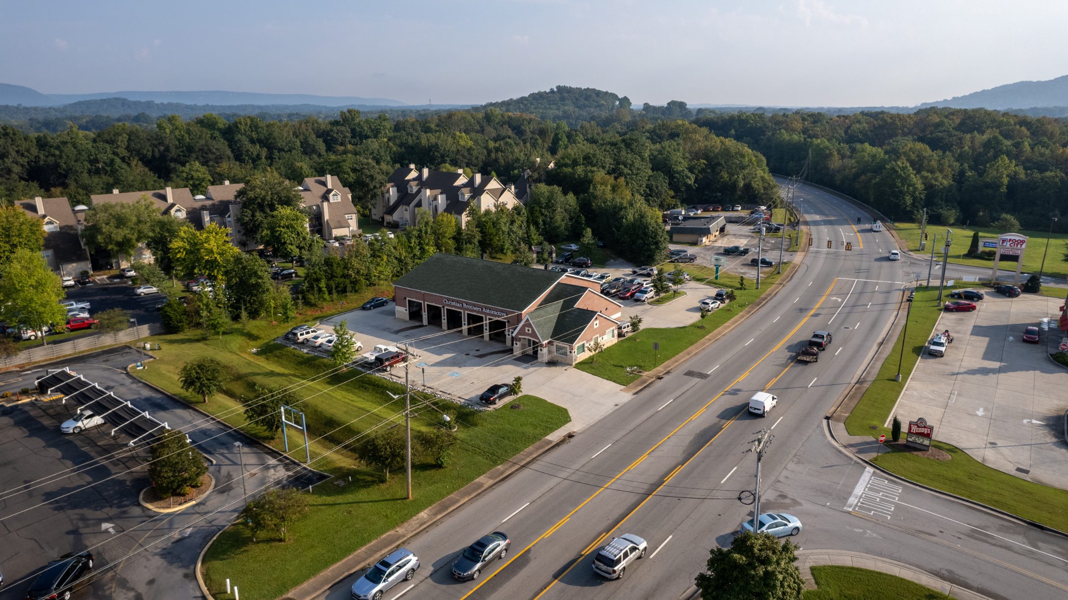 Aerial view of Christian Brothers Automotive on a busy Hixson road
