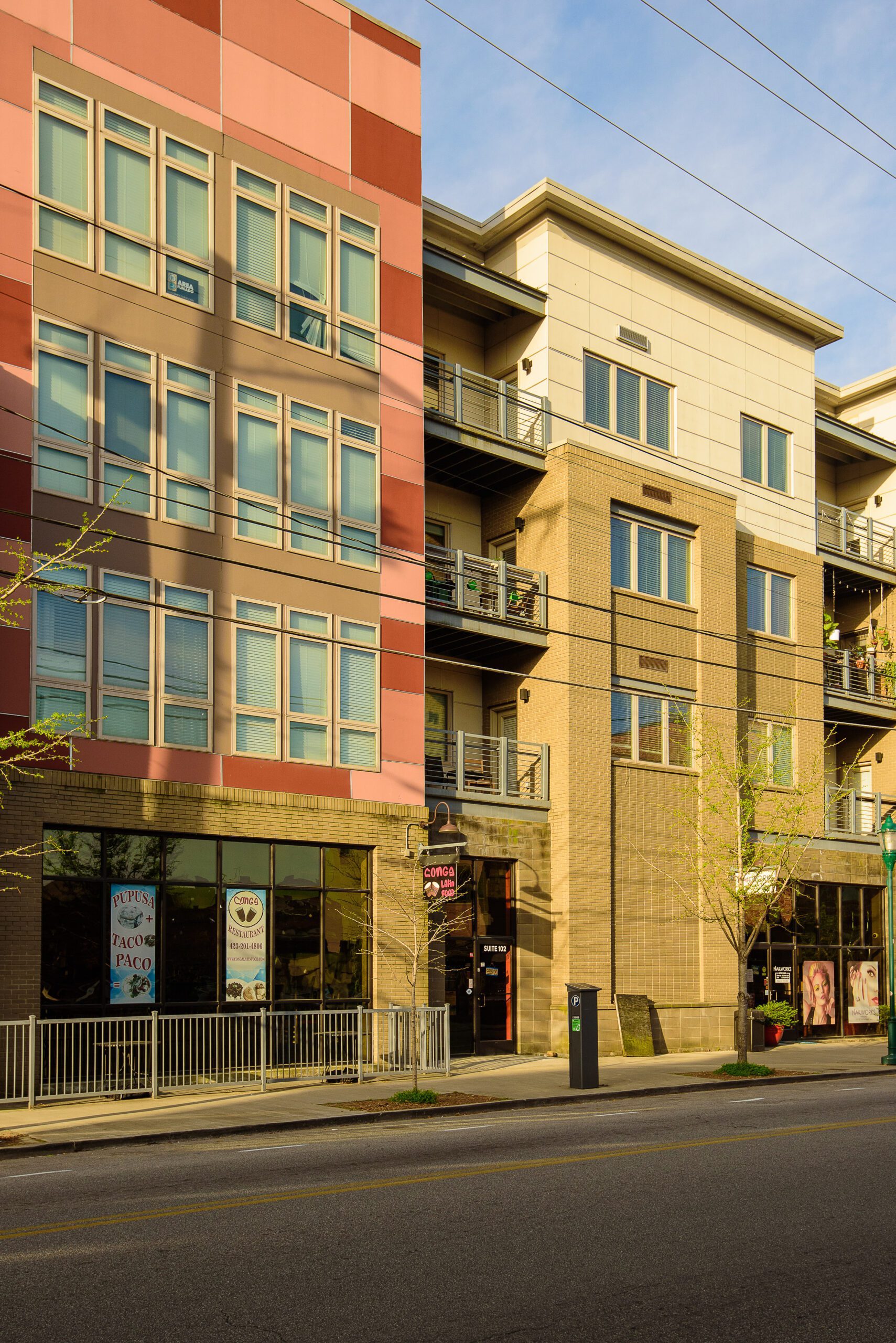 The full street elevation of 26 East Main, four storeys of residential over ground-floor storefronts