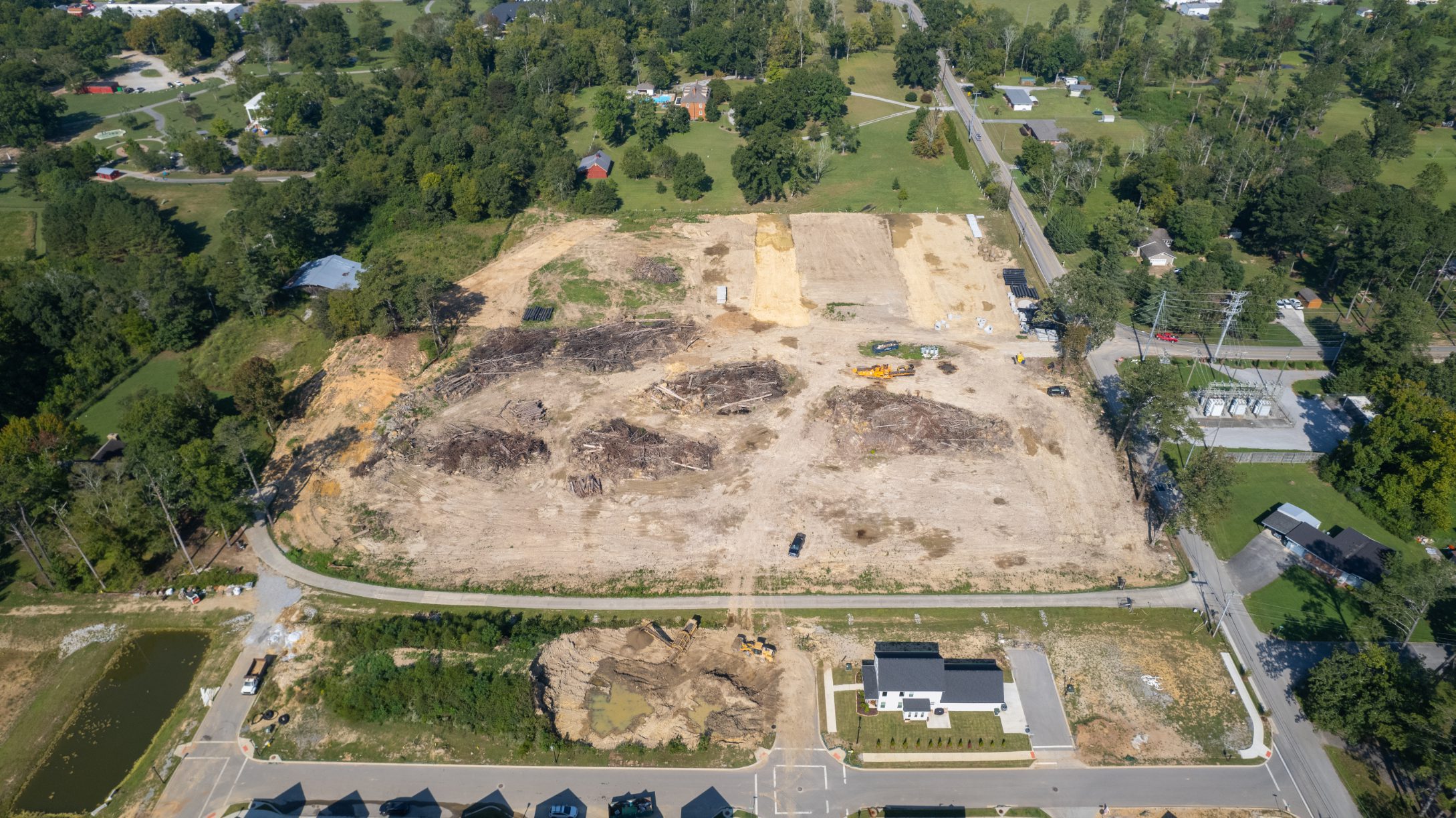 Overhead view of grading and stockpiles across the Phase 2A site