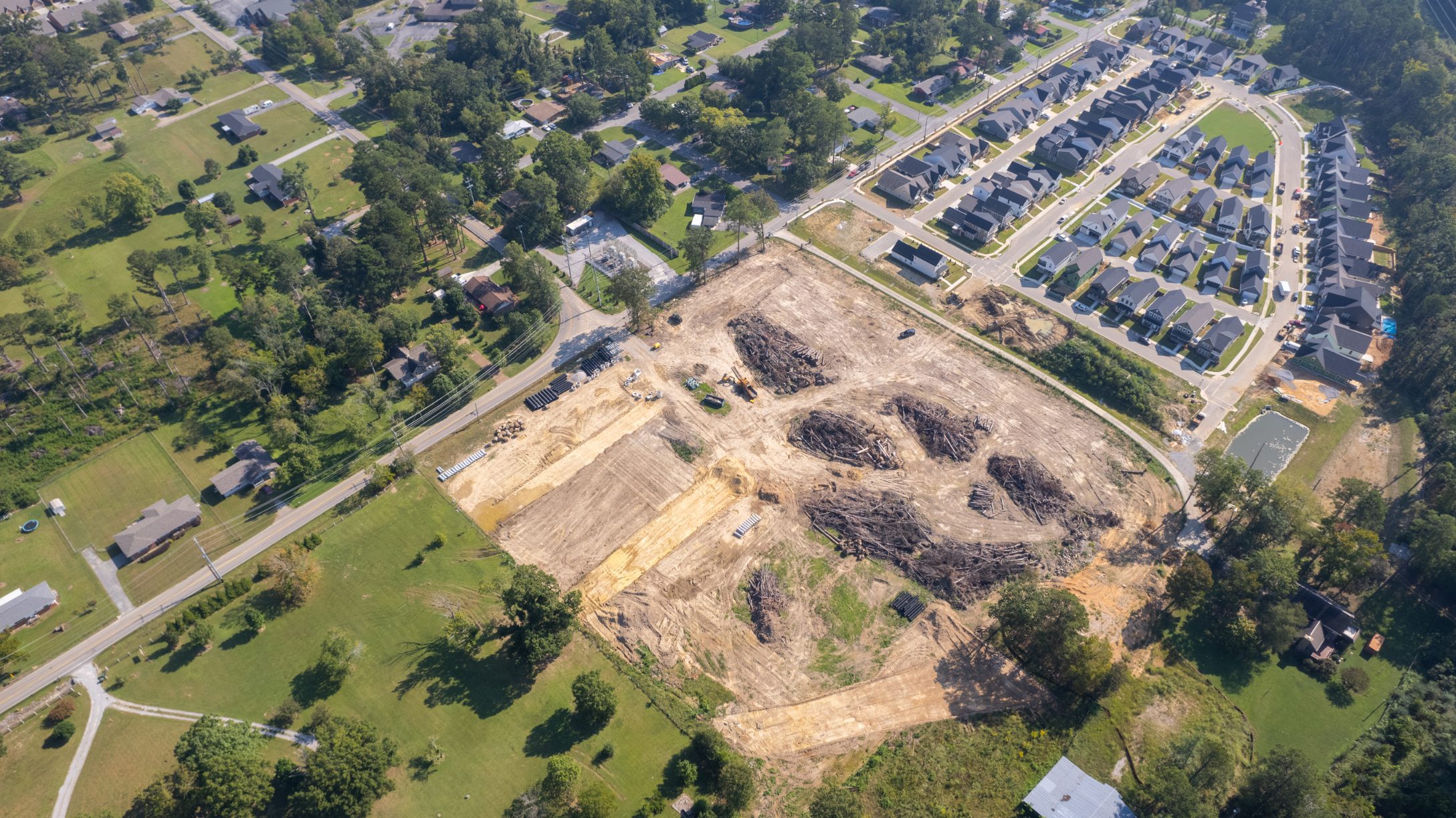 Aerial view of the cleared site with lots turned toward the existing road