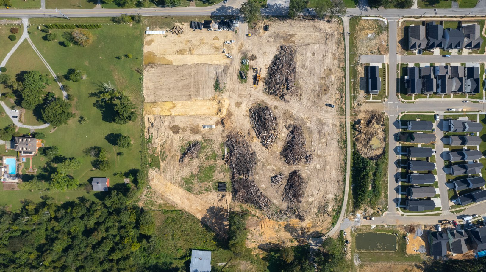 Overhead view of the site between the neighboring pasture and the finished streets