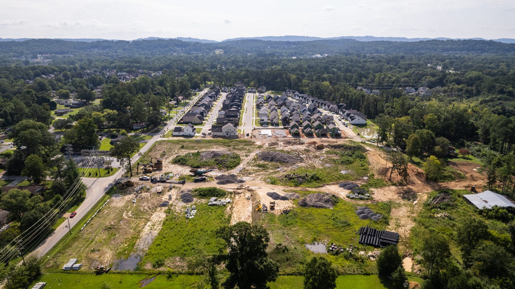 Aerial view of the Phase 2A site with the finished Phase 1 streets beyond